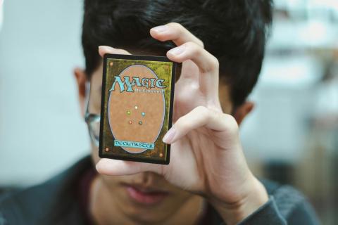 Image of a card player from Unsplash.com